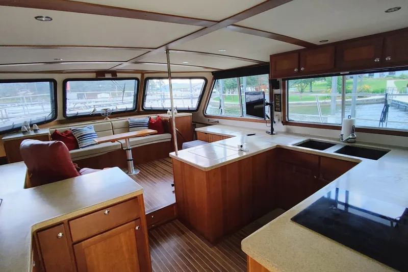 Slide: The Image of Interior of a 2009 Maine Cat P-47 with spacious kitchen and seating area. - 27
