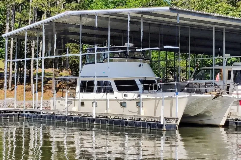 Slide: The Image of A 2009 Maine Cat P-47 docked in a covered boat slip. - 2