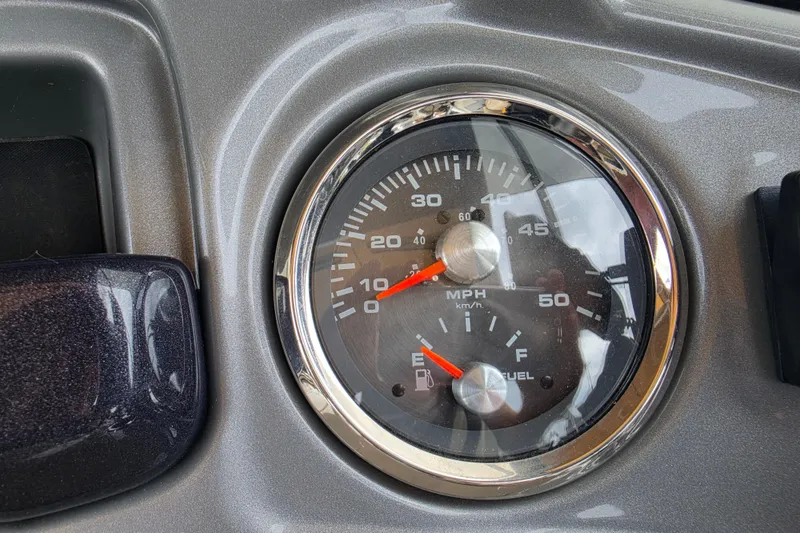 Slide: The Image of Dashboard of 2023 Sun Tracker Bass Buggy 18 DLX showing speedometer and fuel gauge. - 25