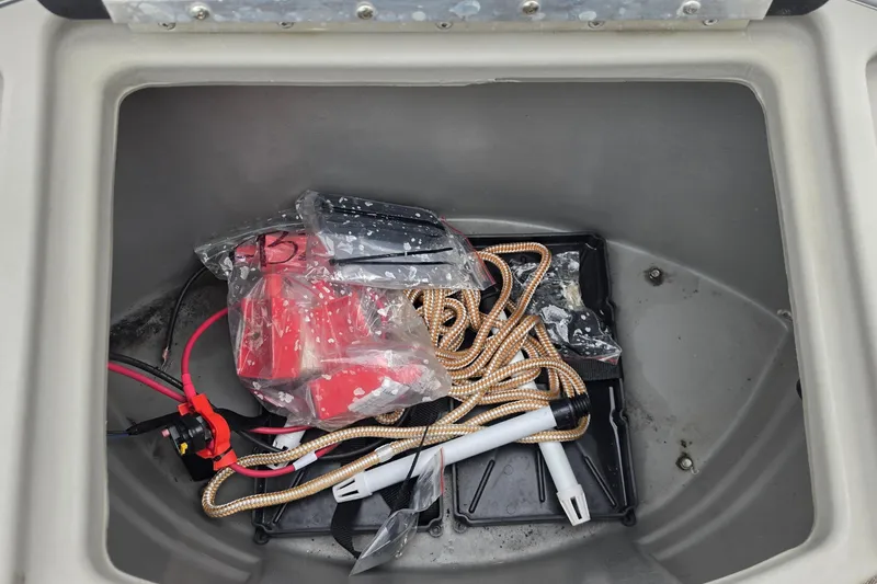 Slide: The Image of Storage compartment of 2023 Sun Tracker Bass Buggy 18 DLX with ropes and accessories. - 34