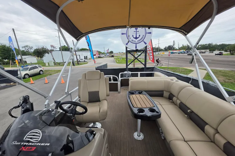 Slide: The Image of 2023 Sun Tracker Bass Buggy 18 DLX pontoon boat with spacious seating and modern helm. - 42