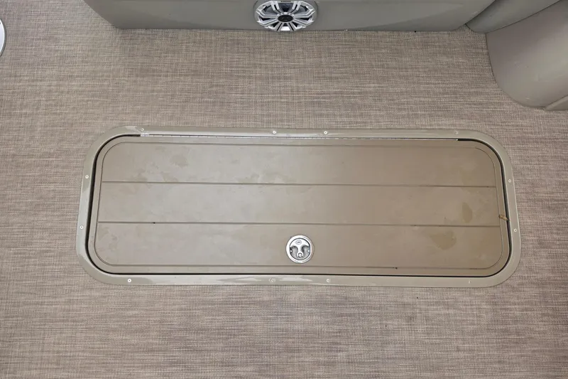 Slide: The Image of 2023 Sun Tracker Bass Buggy 18 DLX boat interior with storage compartment and speaker. - 38