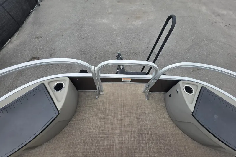 Slide: The Image of 2023 Sun Tracker Bass Buggy 18 DLX pontoon boat deck with railing and cup holders. - 30