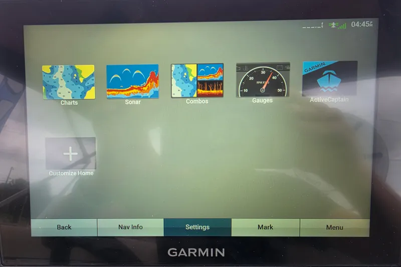 Slide: The Image of Garmin marine display showing navigation options on a 2023 Sun Tracker Bass Buggy 18 DLX. - 23