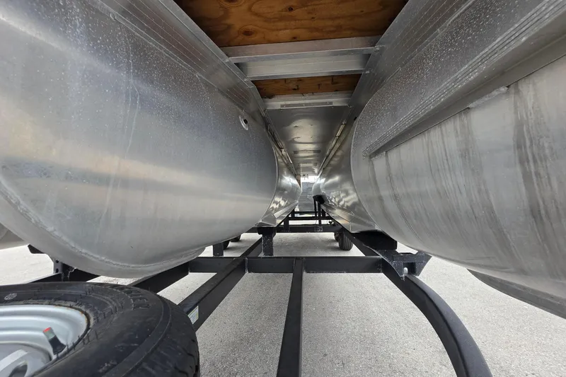 Slide: The Image of Underneath view of 2023 Sun Tracker Bass Buggy 18 DLX pontoon boat on trailer. - 13