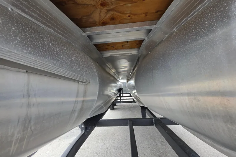 Slide: The Image of Underneath view of 2023 Sun Tracker Bass Buggy 18 DLX pontoon boat, showcasing aluminum pontoons. - 14