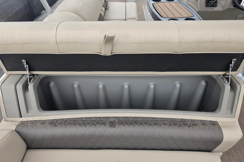 Slide: The Image of 2023 Sun Tracker Bass Buggy 18 DLX storage compartment with cushioned seating and modern design. - 49