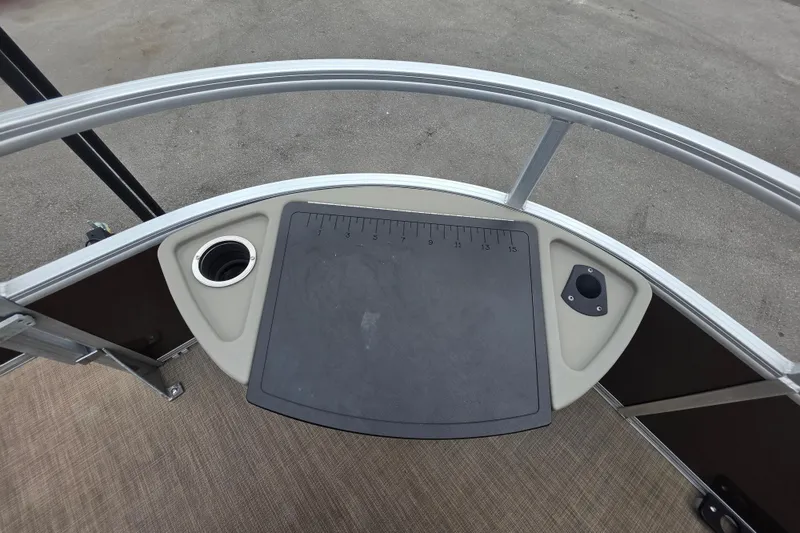 Slide: The Image of 2023 Sun Tracker Bass Buggy 18 DLX fishing platform with cup holder and measuring board. - 31