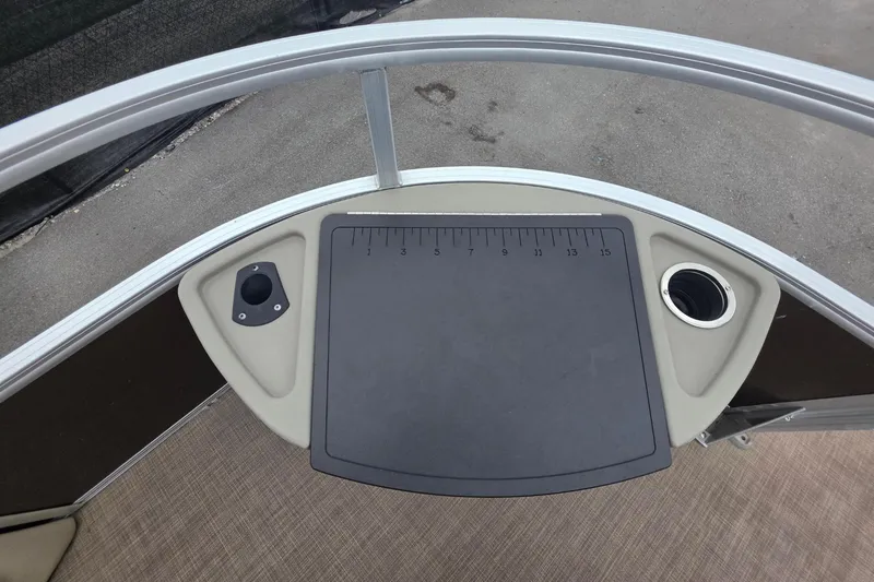 Slide: The Image of 2023 Sun Tracker Bass Buggy 18 DLX deck with ruler and cup holder. - 33