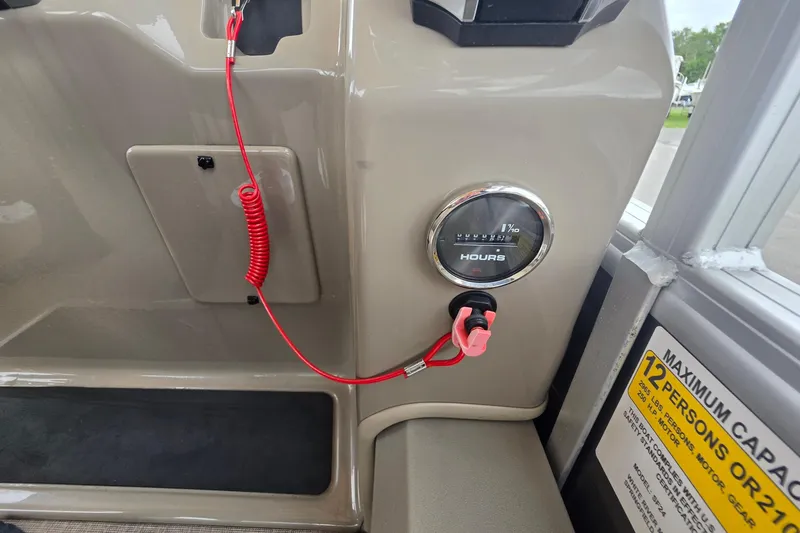 Slide: The Image of 2023 Sun Tracker Bass Buggy 18 DLX dashboard with hour meter and safety lanyard. - 26