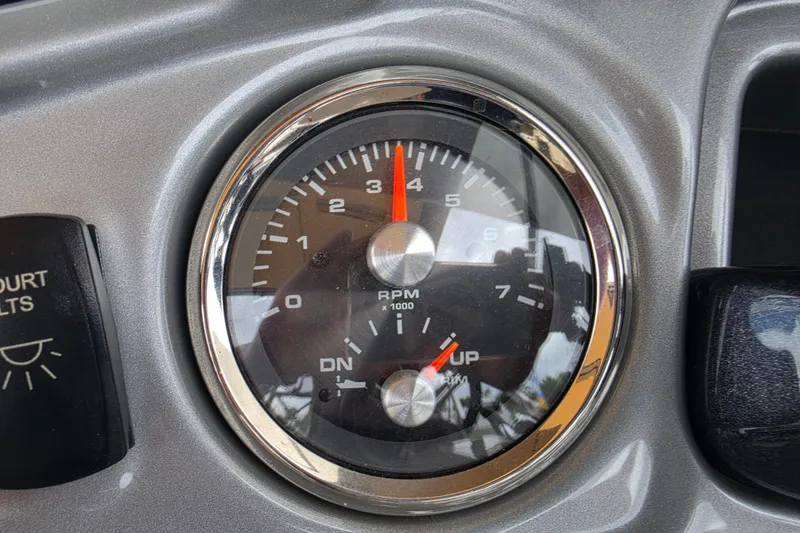 Slide: The Image of Tachometer of 2023 Sun Tracker Bass Buggy 18 DLX showing RPM and trim indicators. - 24