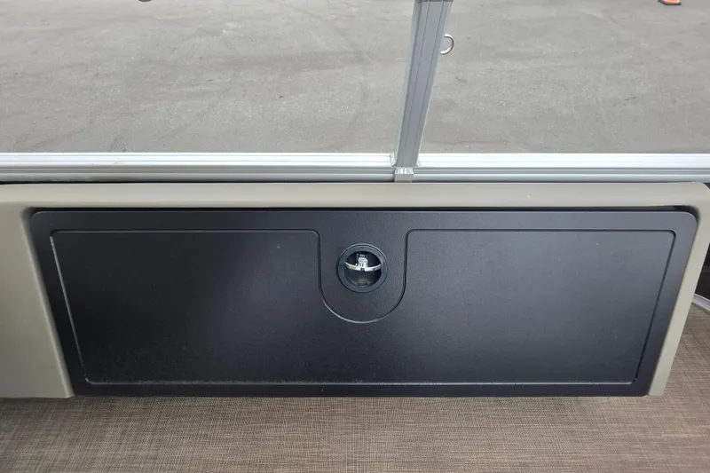 Slide: The Image of 2023 Sun Tracker Bass Buggy 18 DLX storage compartment with secure latch. - 54