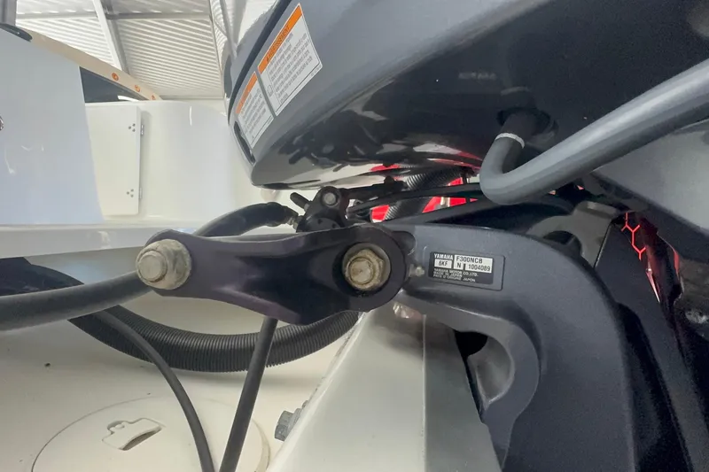 Slide: The Image of Close-up of 2023 Wellcraft 242 Fisherman boat engine components. - 10