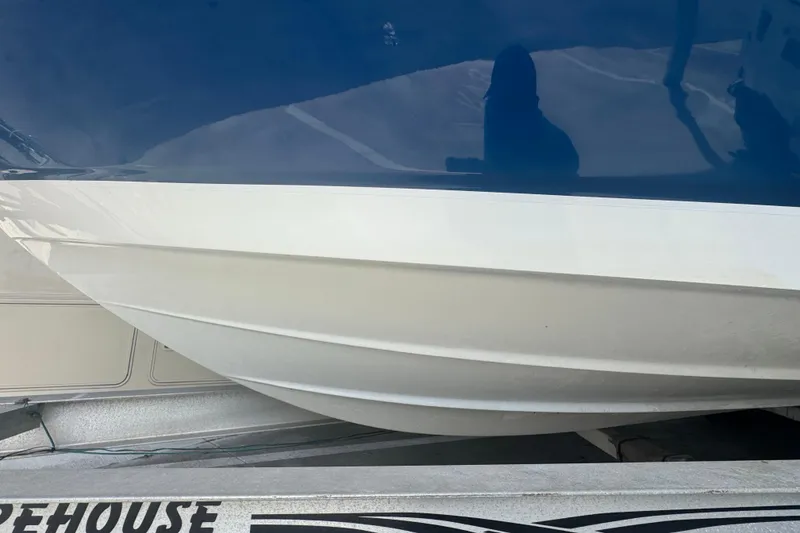 Slide: The Image of 2023 Wellcraft 242 Fisherman boat hull on trailer, showcasing sleek design. - 4