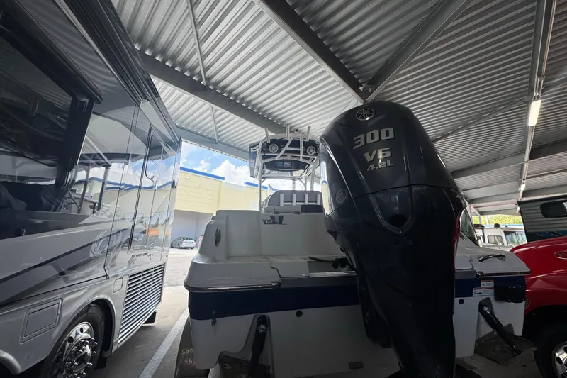 Slide: The Image of 2023 Wellcraft 242 Fisherman boat with Yamaha 300 V6 engine in covered storage. - 6