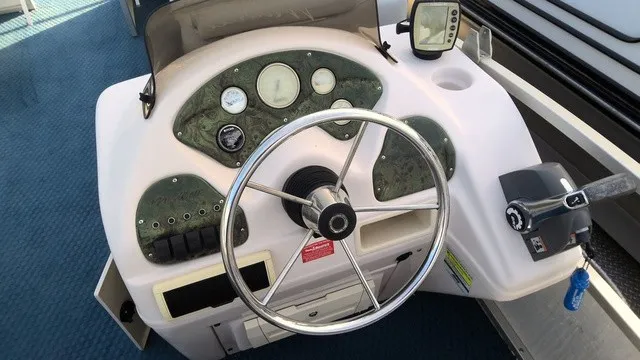 Slide: The Image of The image shows the helm of a 2008 Manitou OASIS 20 with a steering wheel and gauges. - 9