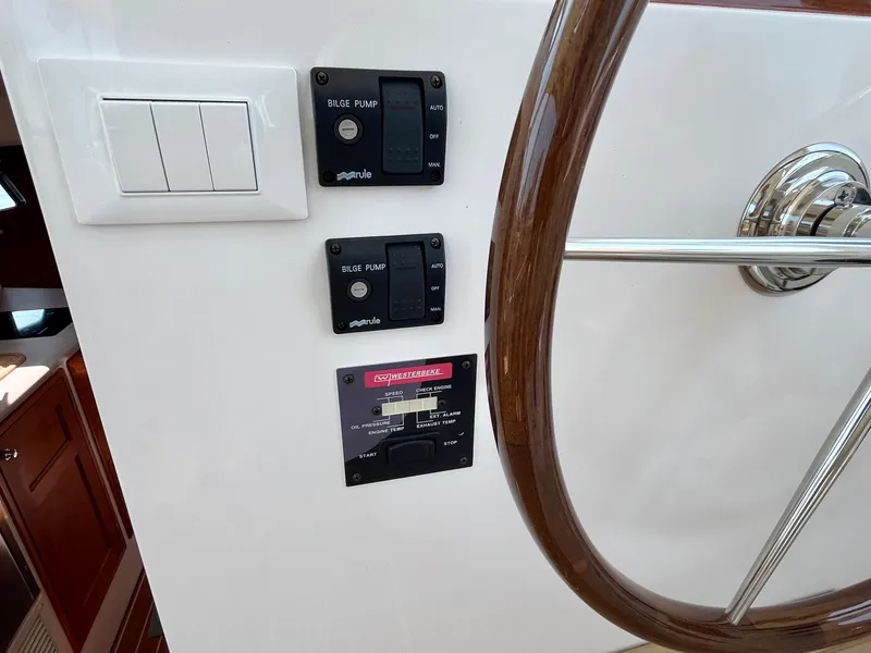 Slide: The Image of Control panel and steering wheel of 2019 MJM 35z boat interior. - 30