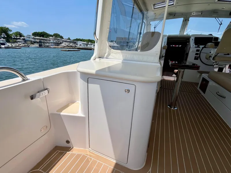 Slide: The Image of 2019 MJM 35z boat interior with sleek design and waterfront view. - 15