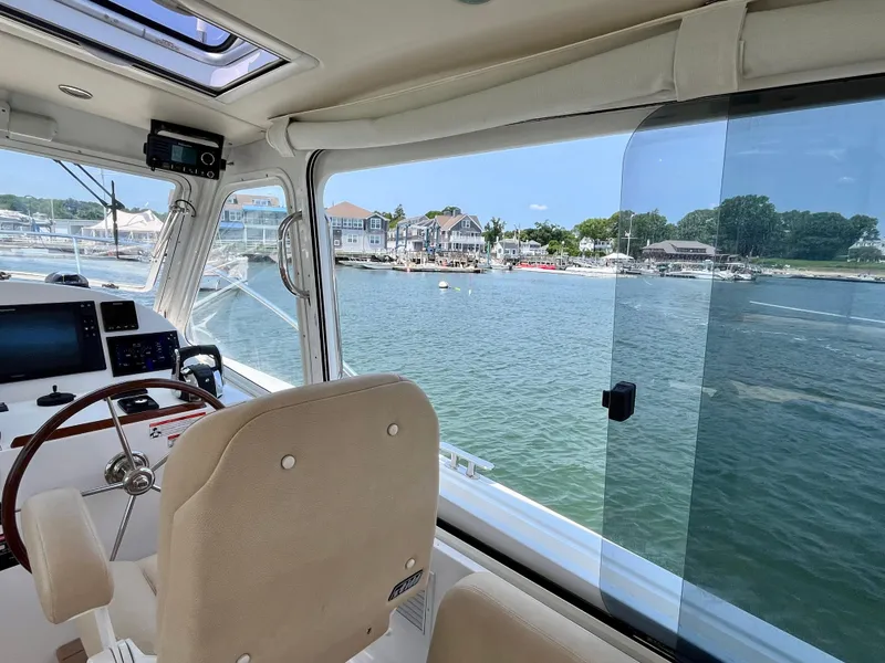 Slide: The Image of Interior view of 2019 MJM 35z boat with waterfront scenery. - 43