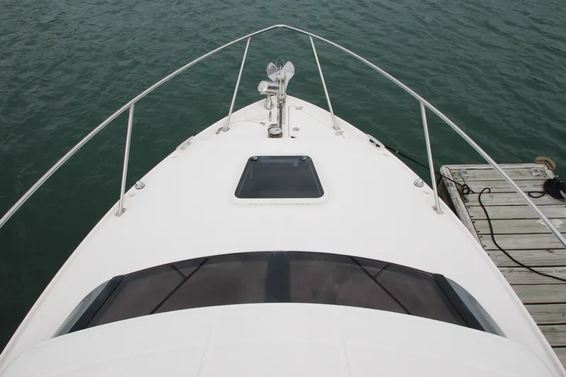 Slide: The Image of 2011 Regal 2860 Window Express boat docked on calm water. - 8