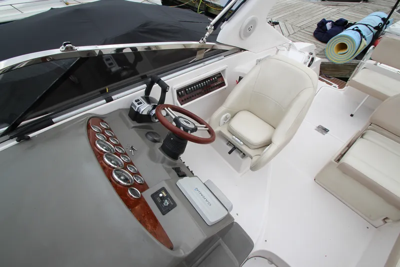 Slide: The Image of 2011 Regal 2860 Window Express boat cockpit with steering wheel and control panel. - 30