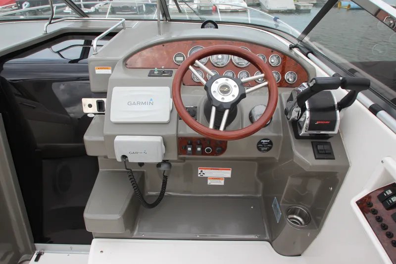 Slide: The Image of 2011 Regal 2860 Window Express boat helm with Garmin navigation system. - 25