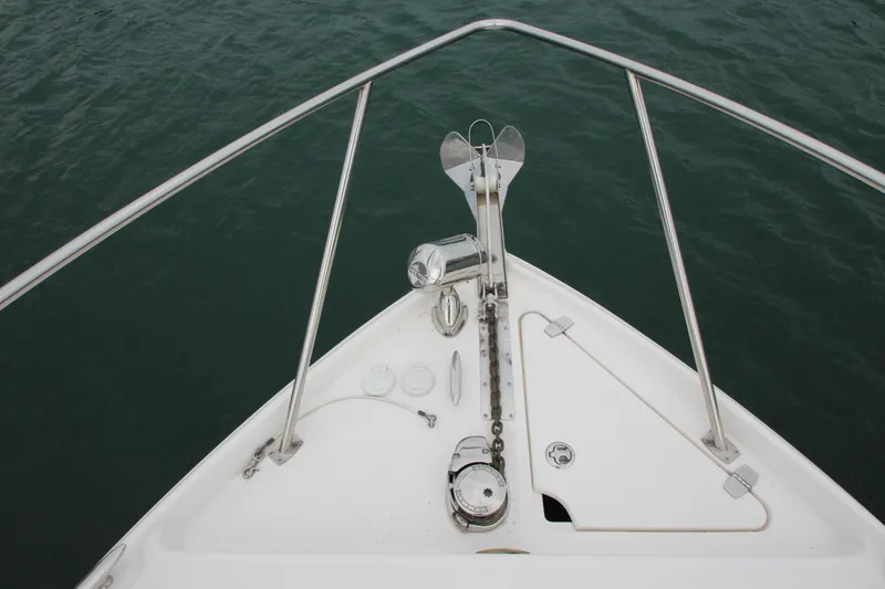 Slide: The Image of Bow of 2011 Regal 2860 Window Express boat with anchor and railing. - 9