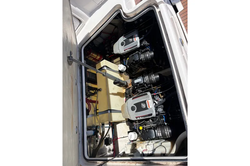 Slide: The Image of Engine compartment of a 2011 Regal 2860 Window Express boat, showcasing dual engines. - 22