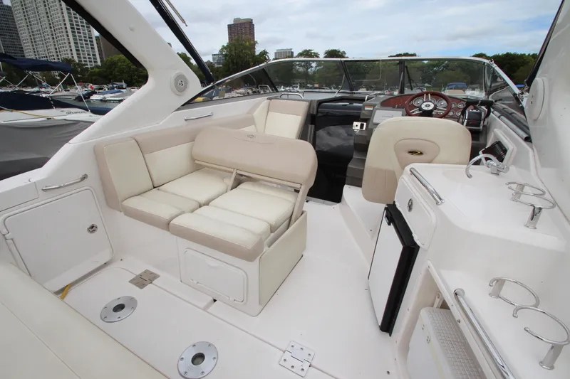 Slide: The Image of 2011 Regal 2860 Window Express boat interior with seating and control panel. - 23