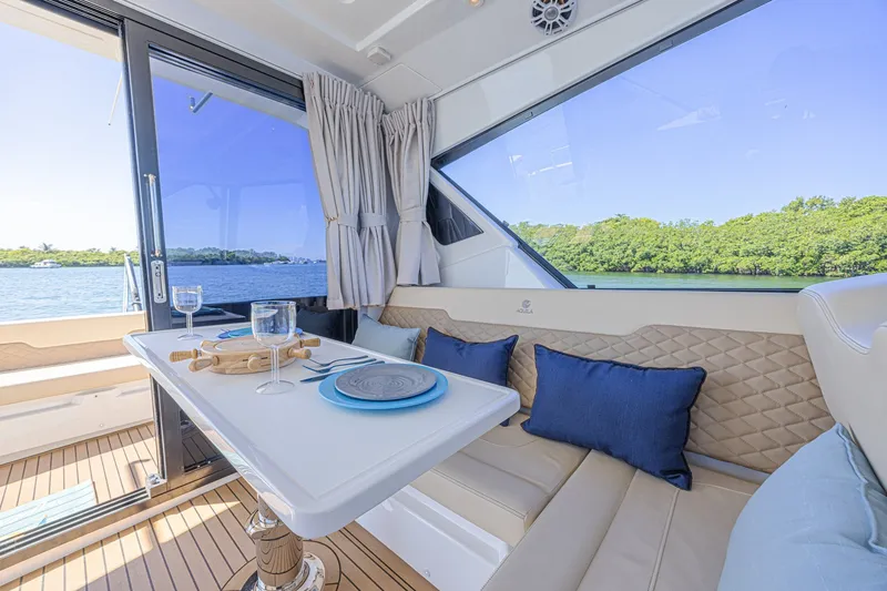 Slide: The Image of Luxurious interior of 2024 Aquila 36 Sport yacht with elegant dining setup. - 23