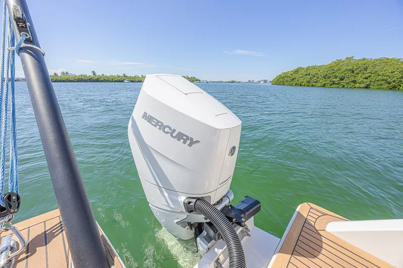 Slide: The Image of 2024 Aquila 36 Sport boat with Mercury engine on calm water. - 20