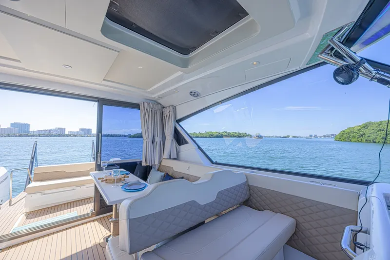 Slide: The Image of Interior view of 2024 Aquila 36 Sport yacht with scenic ocean backdrop. - 24