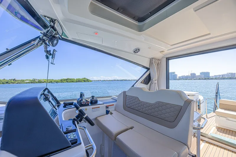 Slide: The Image of Interior view of 2024 Aquila 36 Sport yacht with scenic waterfront backdrop. - 32