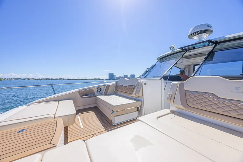 Slide: The Image of 2024 Aquila 36 Sport yacht with luxurious seating on a sunny day. - 15
