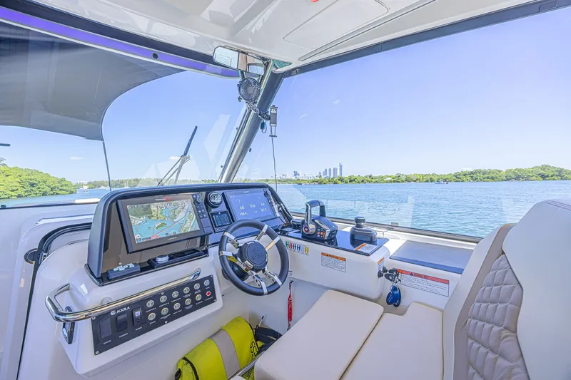 Slide: The Image of Interior view of 2024 Aquila 36 Sport boat cockpit with navigation system. - 33