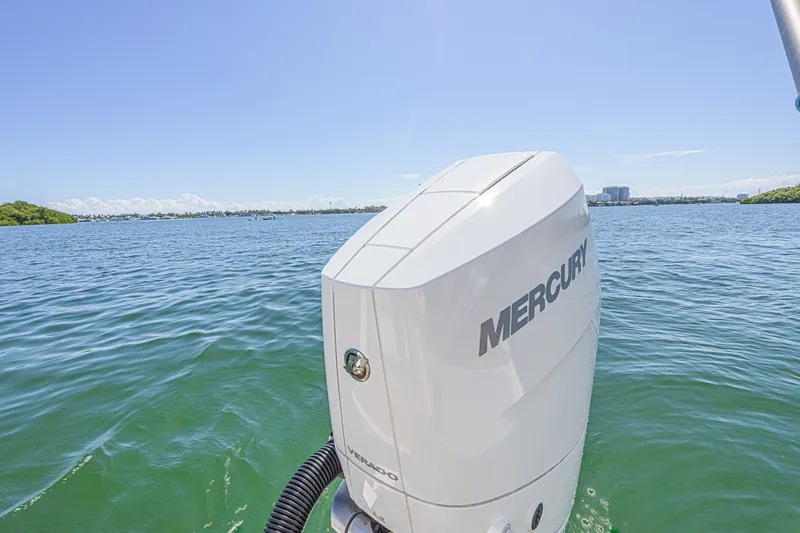 Slide: The Image of Outboard motor on 2024 Aquila 36 Sport boat, cruising on a sunny day. - 21