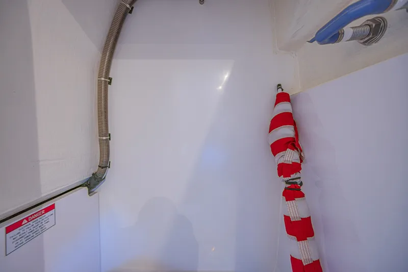 Slide: The Image of Interior view of 2024 Aquila 36 Sport boat, featuring safety equipment and piping. - 46