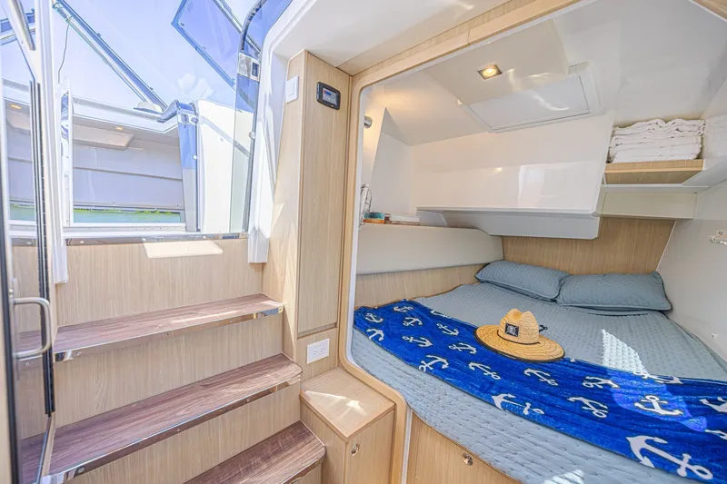 Slide: The Image of Luxurious cabin interior of 2024 Aquila 36 Sport yacht with cozy bedding and natural light. - 44