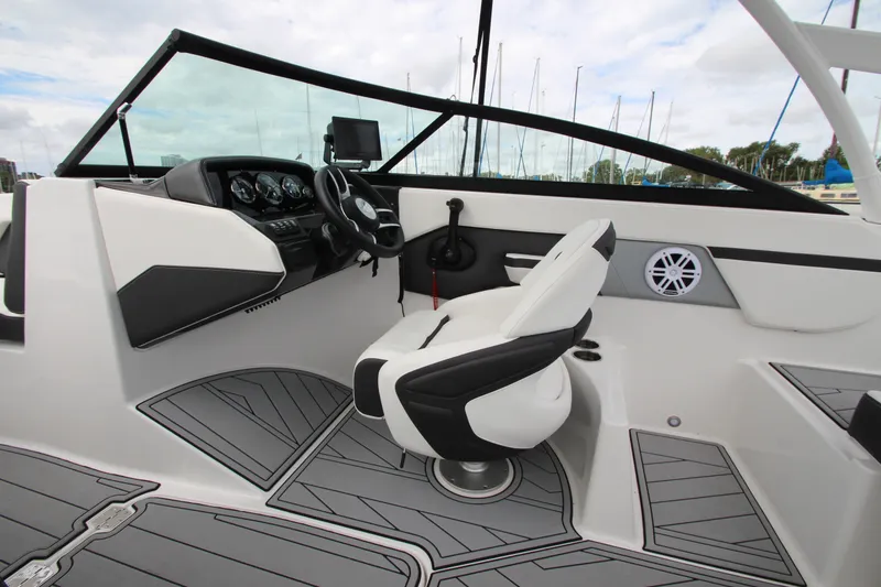 Slide: The Image of 2025 Monterey M-22 boat interior with modern dashboard and comfortable seating. - 11