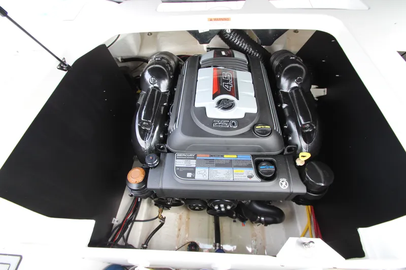 Slide: The Image of Engine compartment of 2025 Monterey M-22 boat featuring a Mercury 4.5L 250 HP engine. - 23