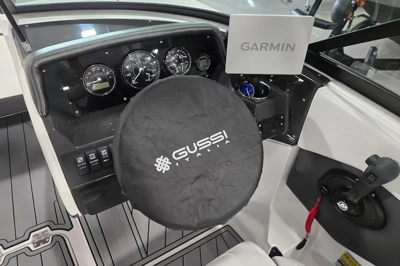 Slide: The Image of 2025 Monterey M-22 boat dashboard with Garmin display and Gussi Italia steering wheel cover. - 5