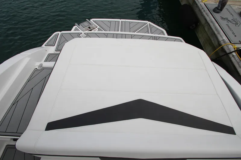 Slide: The Image of 2025 Monterey M-22 boat deck with sleek design, docked by the water. - 8