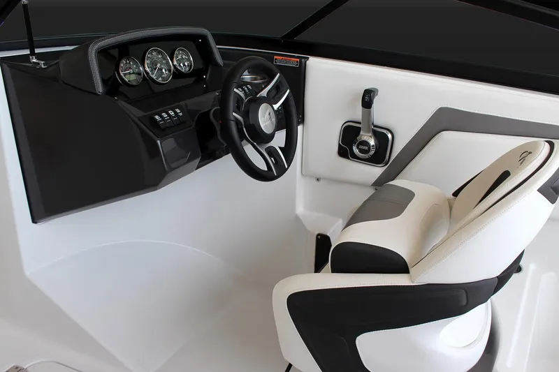Slide: The Image of Manufacturer Provided Image: 2025 Monterey M-22 boat cockpit with modern steering and controls, featuring sleek design and comfortable seating. - 8