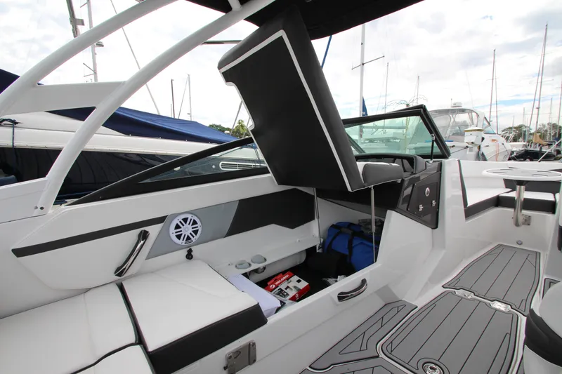 Slide: The Image of 2025 Monterey M-22 boat interior with seating, storage, and modern design elements. - 24