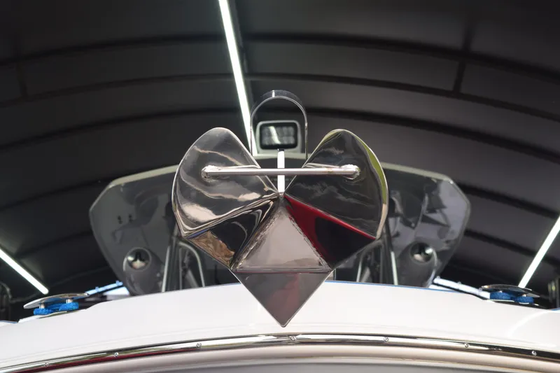 Slide: The Image of 2022 Aquasport 2300 Center Console boat anchor detail in a modern showroom. - 8