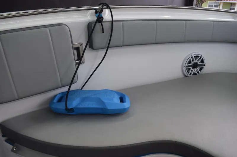 Slide: The Image of 2022 Aquasport 2300 Center Console interior with speaker and blue accessory. - 30