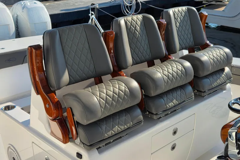 Slide: The Image of Luxurious seating on 2021 Valhalla Boatworks V-41, featuring diamond-stitched leather and wooden accents. - 25