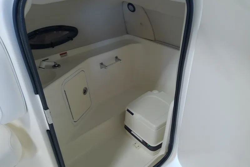Slide: The Image of Interior of 2012 Hurricane SunDeck 217 OB boat with compact toilet. - 33