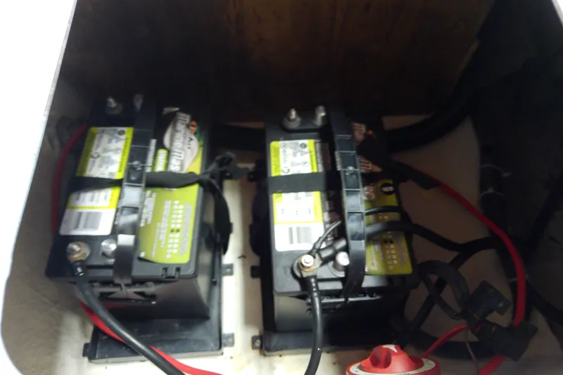 Slide: The Image of Dual batteries in a 2012 Hurricane SunDeck 217 OB boat compartment. - 44
