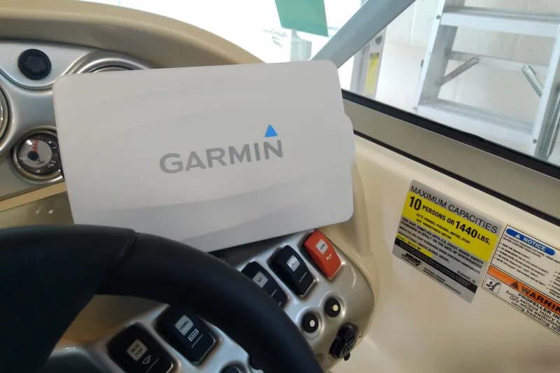 Slide: The Image of Dashboard of 2012 Hurricane SunDeck 217 OB with Garmin device and capacity label. - 30